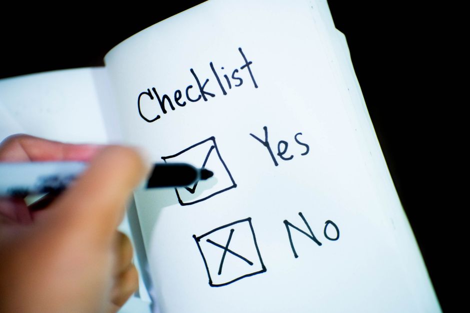 A handwritten checklist with yes and no checkboxes
